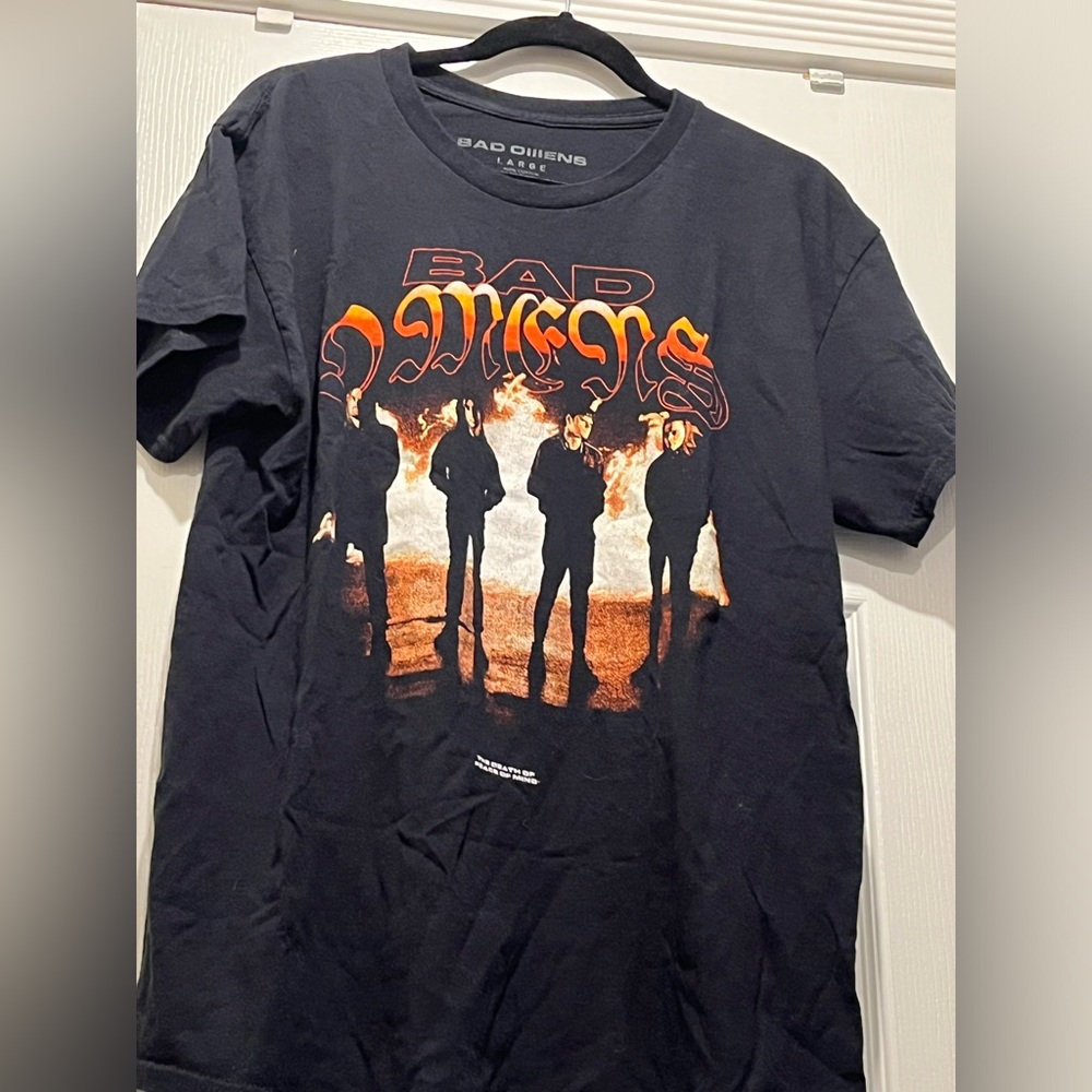 Bad omens face in the fire shirt